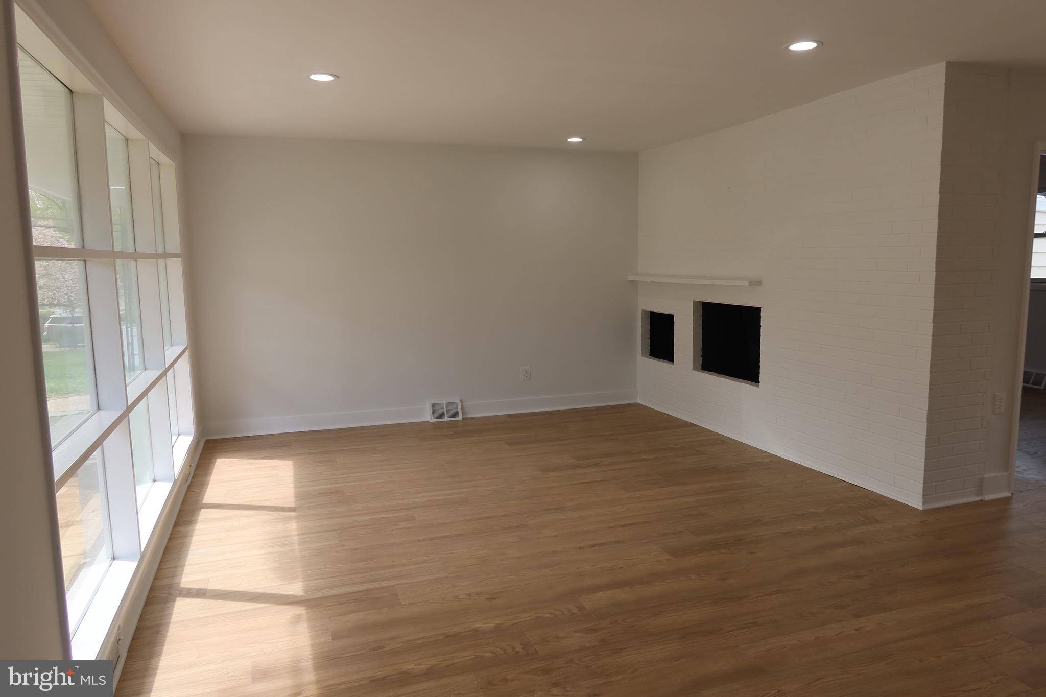 700 Fraser Road Glenside, PA 19038 - Photo 24 of 46 a view of an empty room with wooden floor and a window