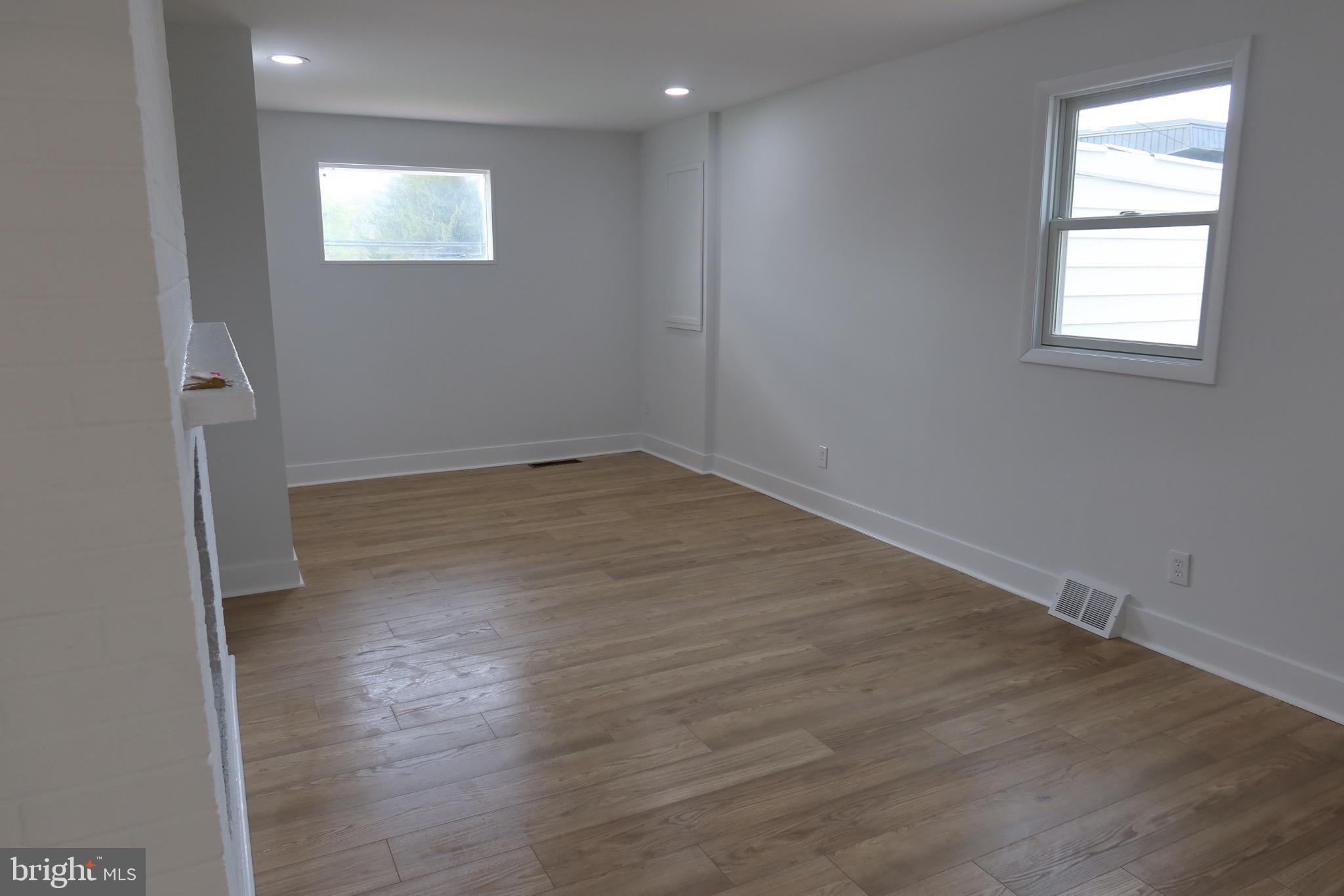 700 Fraser Road Glenside, PA 19038 - Photo 25 of 46 an empty room with wooden floor and windows
