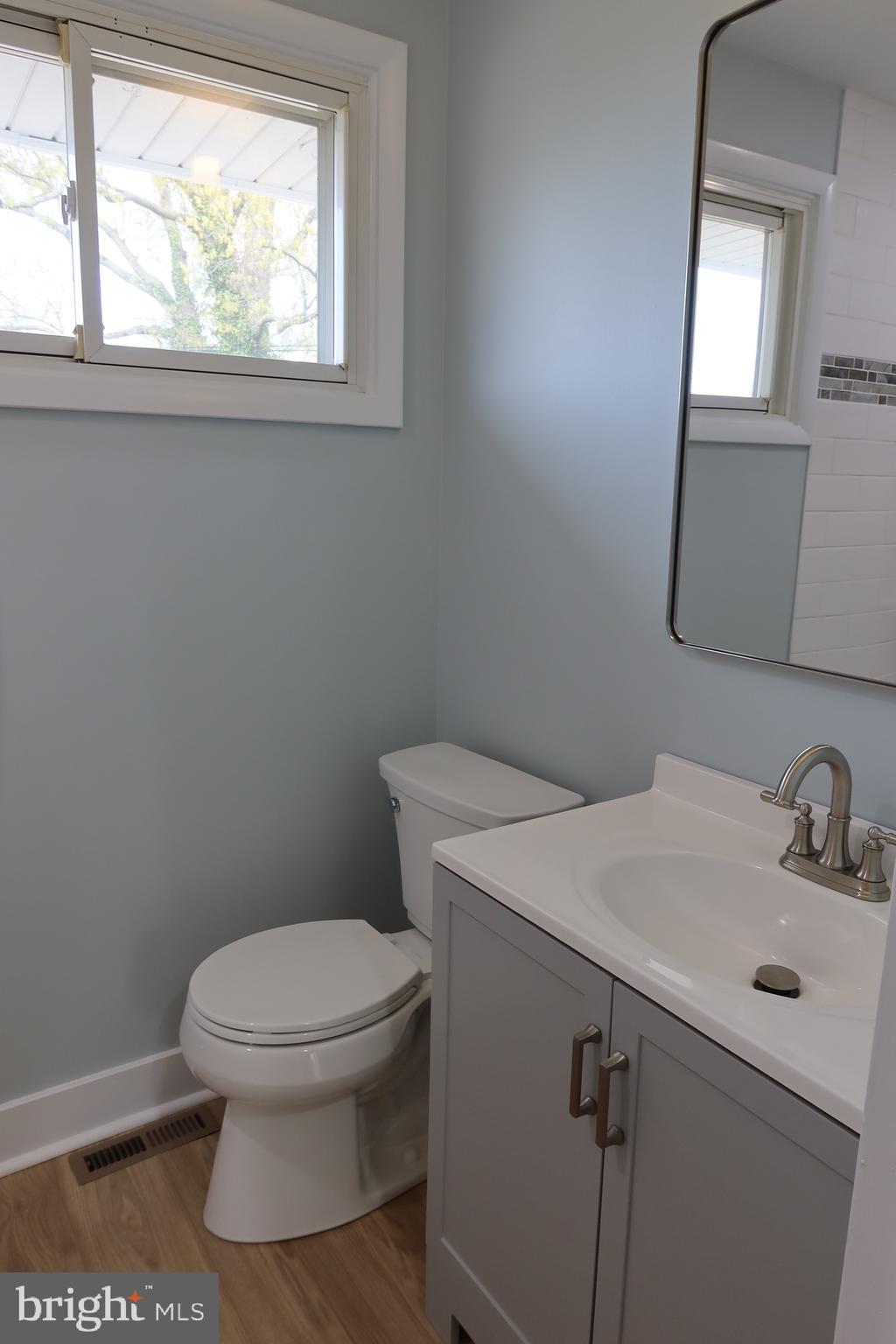 700 Fraser Road Glenside, PA 19038 - Photo 33 of 46 a bathroom with a toilet a sink and a window