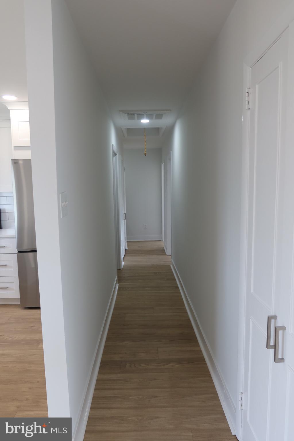 700 Fraser Road Glenside, PA 19038 - Photo 34 of 46 a view of a hallway with wooden floor and staircase
