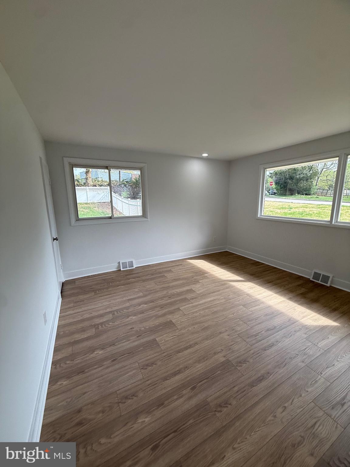 700 Fraser Road Glenside, PA 19038 - Photo 37 of 46 an empty room with wooden floor and windows