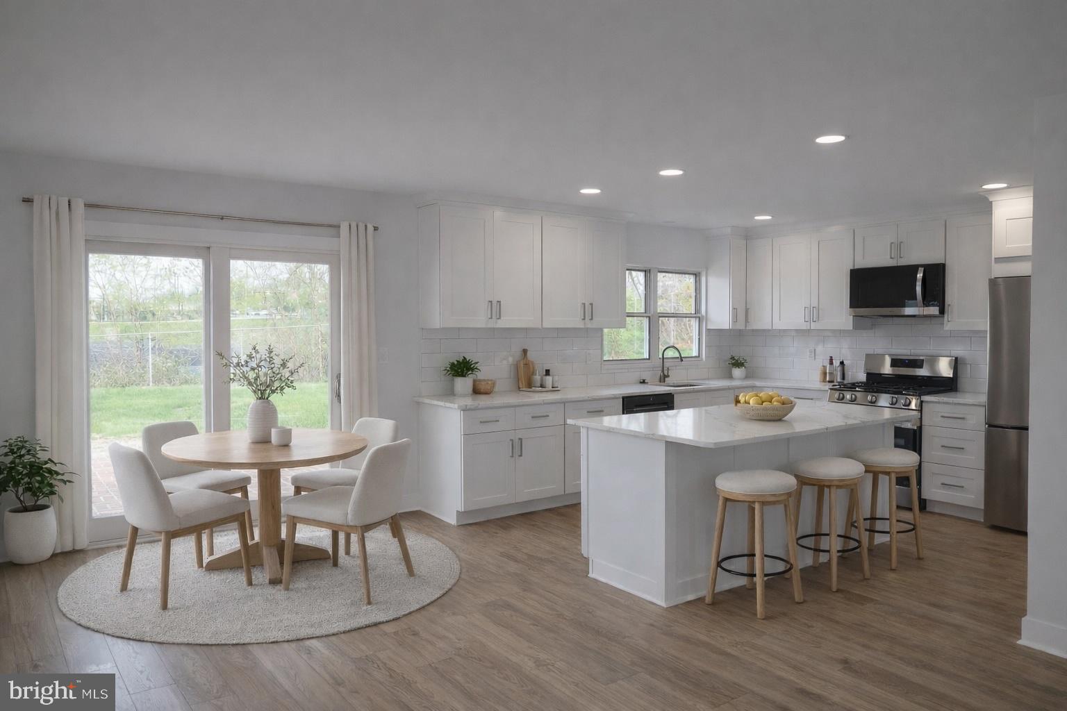 700 Fraser Road Glenside, PA 19038 - Photo 10 of 46 a kitchen with a table chairs a sink and cabinets