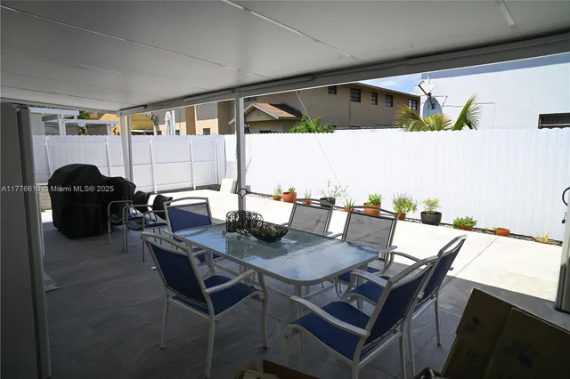 a view of a house with furniture and a stove