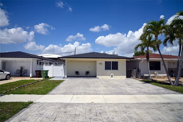 a house with yard in front of it
