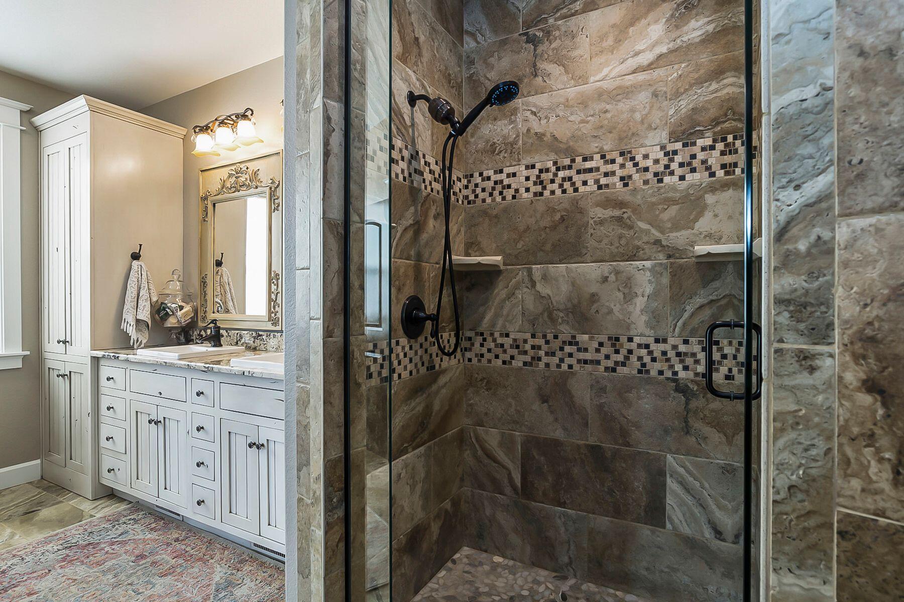 21530 Dale Road Bend, OR 97701 - Photo 19 of 46 a bathroom with a granite countertop shower sink and mirror