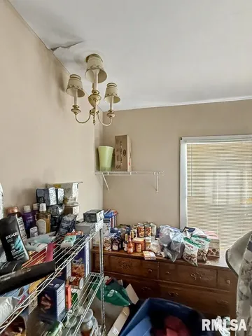 a table room with furniture and a window