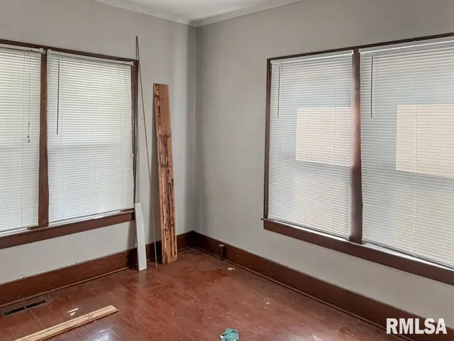 a view of front door with wooden floor