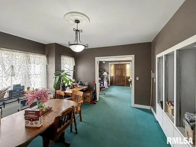 a view of a dining room with furniture window and outside view