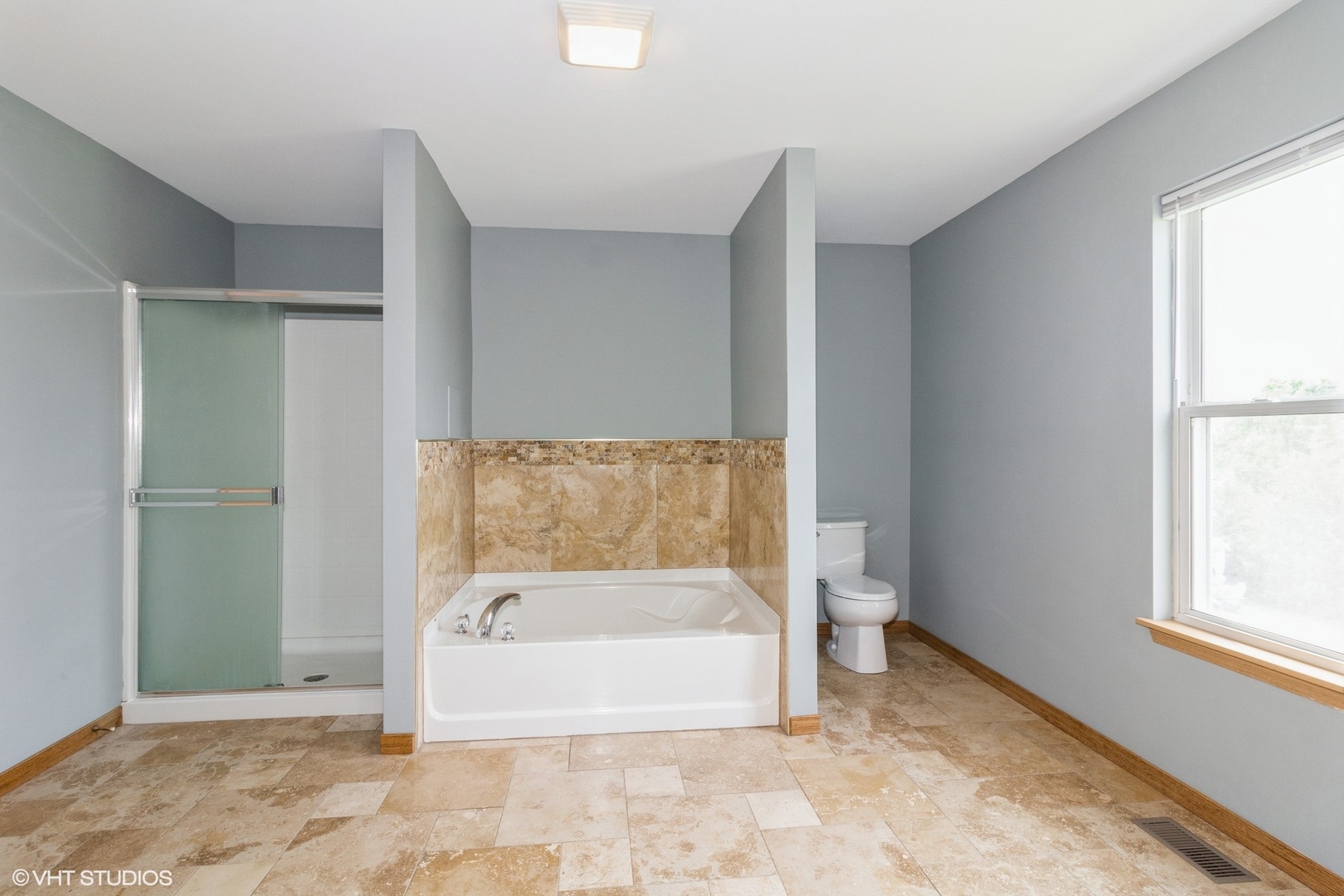 603 Kennedy Street Waterman, IL 60556 - Photo 13 of 25 a spacious bathroom with a bathtub and a rug