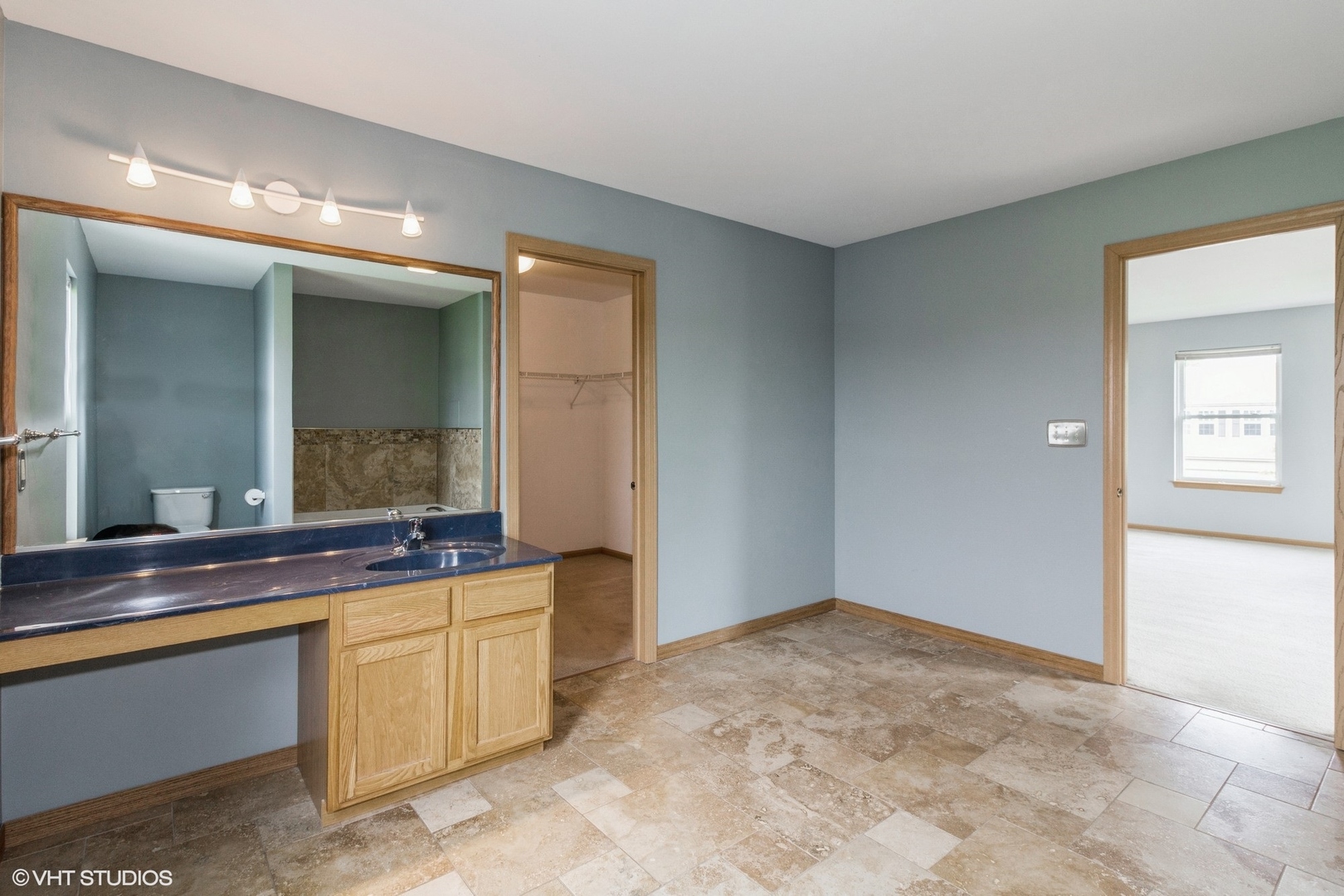 603 Kennedy Street Waterman, IL 60556 - Photo 14 of 25 a spacious bathroom with a sink and a mirror