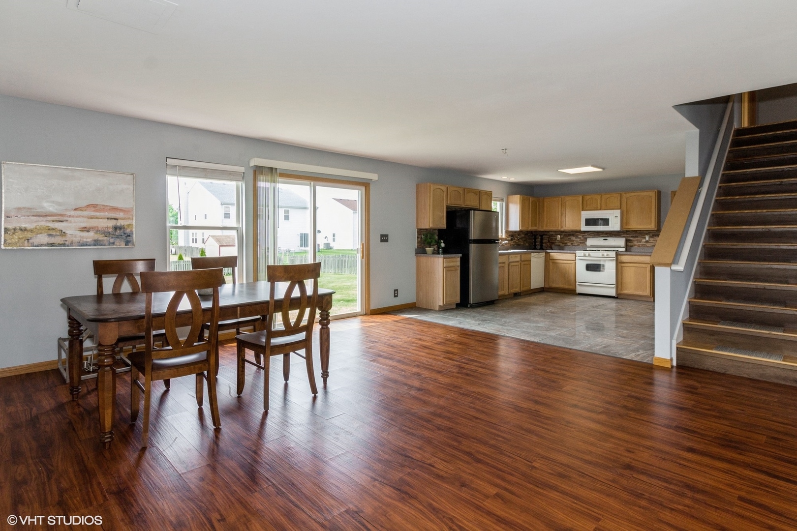 603 Kennedy Street Waterman, IL 60556 - Photo 4 of 25 a view of a dining room with furniture window and wooden floor