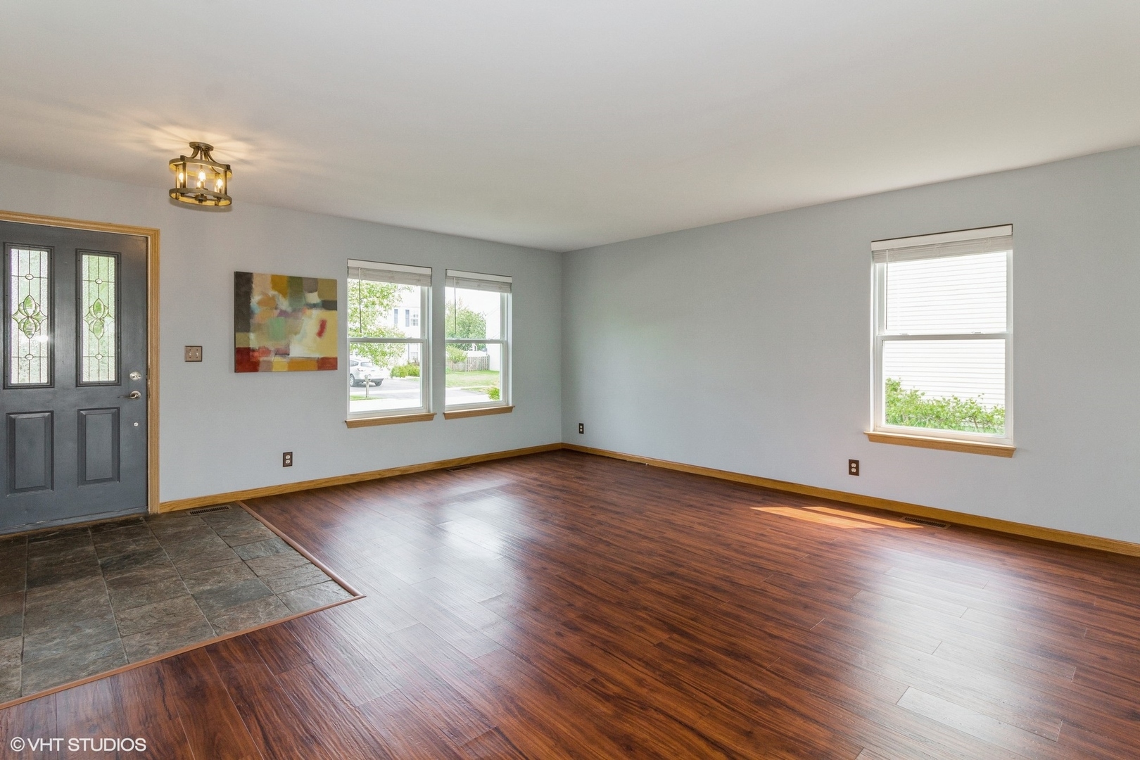603 Kennedy Street Waterman, IL 60556 - Photo 5 of 25 an empty room with wooden floor and windows
