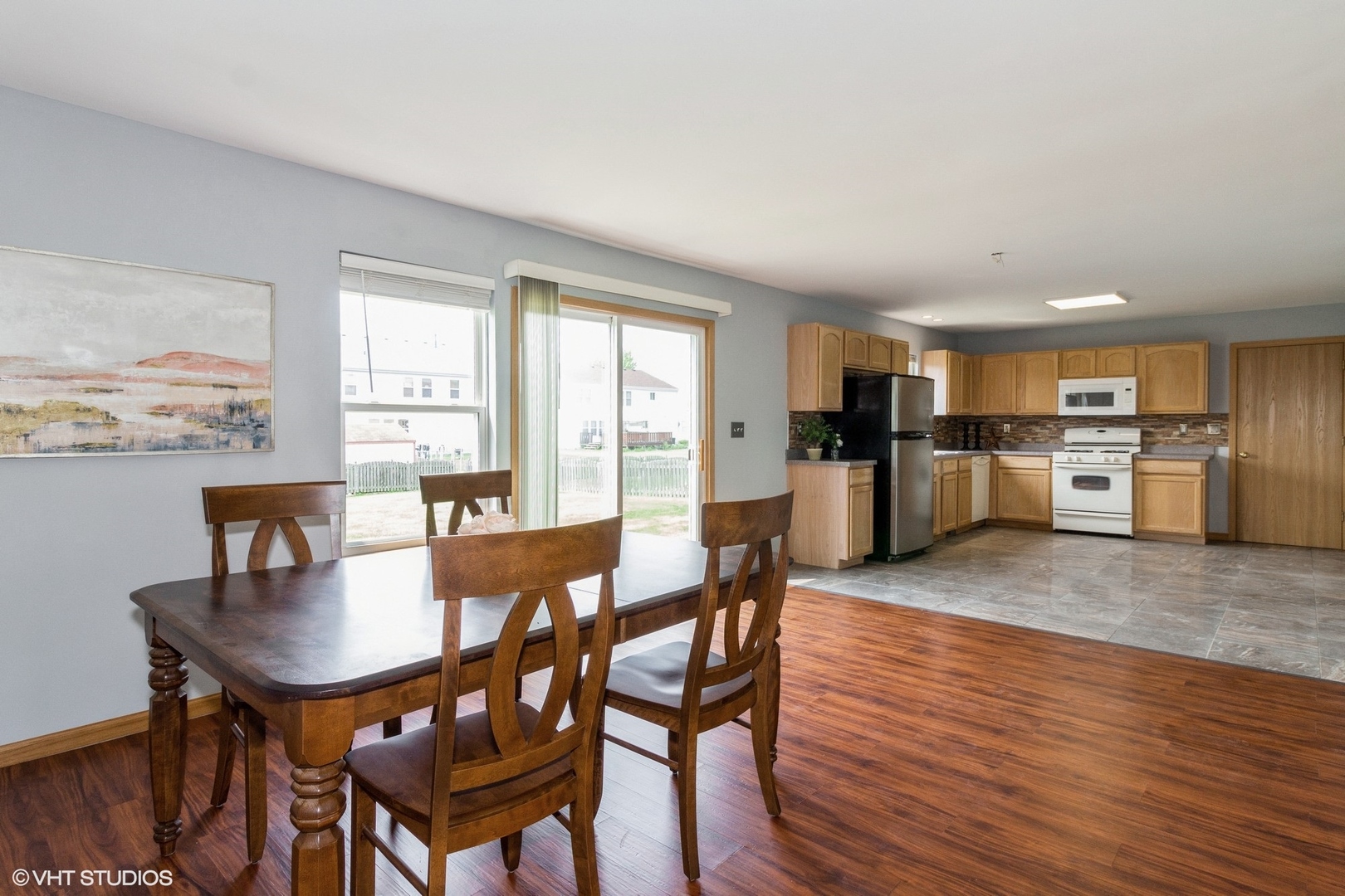 603 Kennedy Street Waterman, IL 60556 - Photo 7 of 25 a view of a dining room with furniture and wooden floor