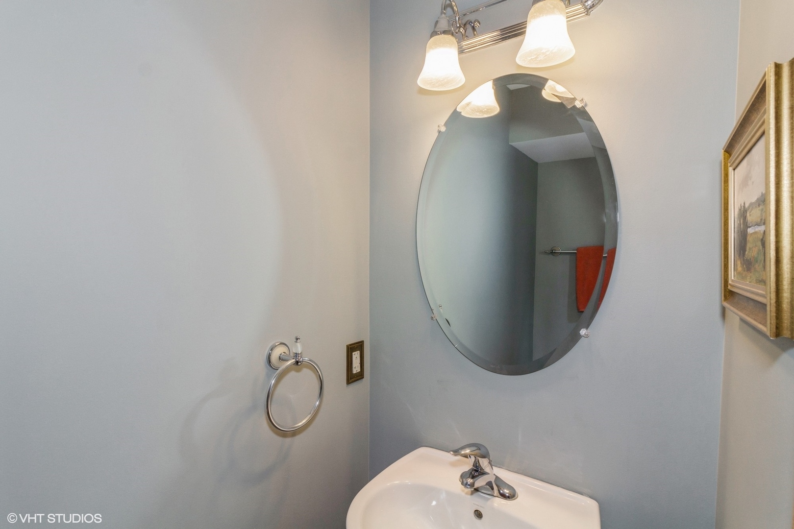 603 Kennedy Street Waterman, IL 60556 - Photo 10 of 25 a bathroom with a mirror and a sink