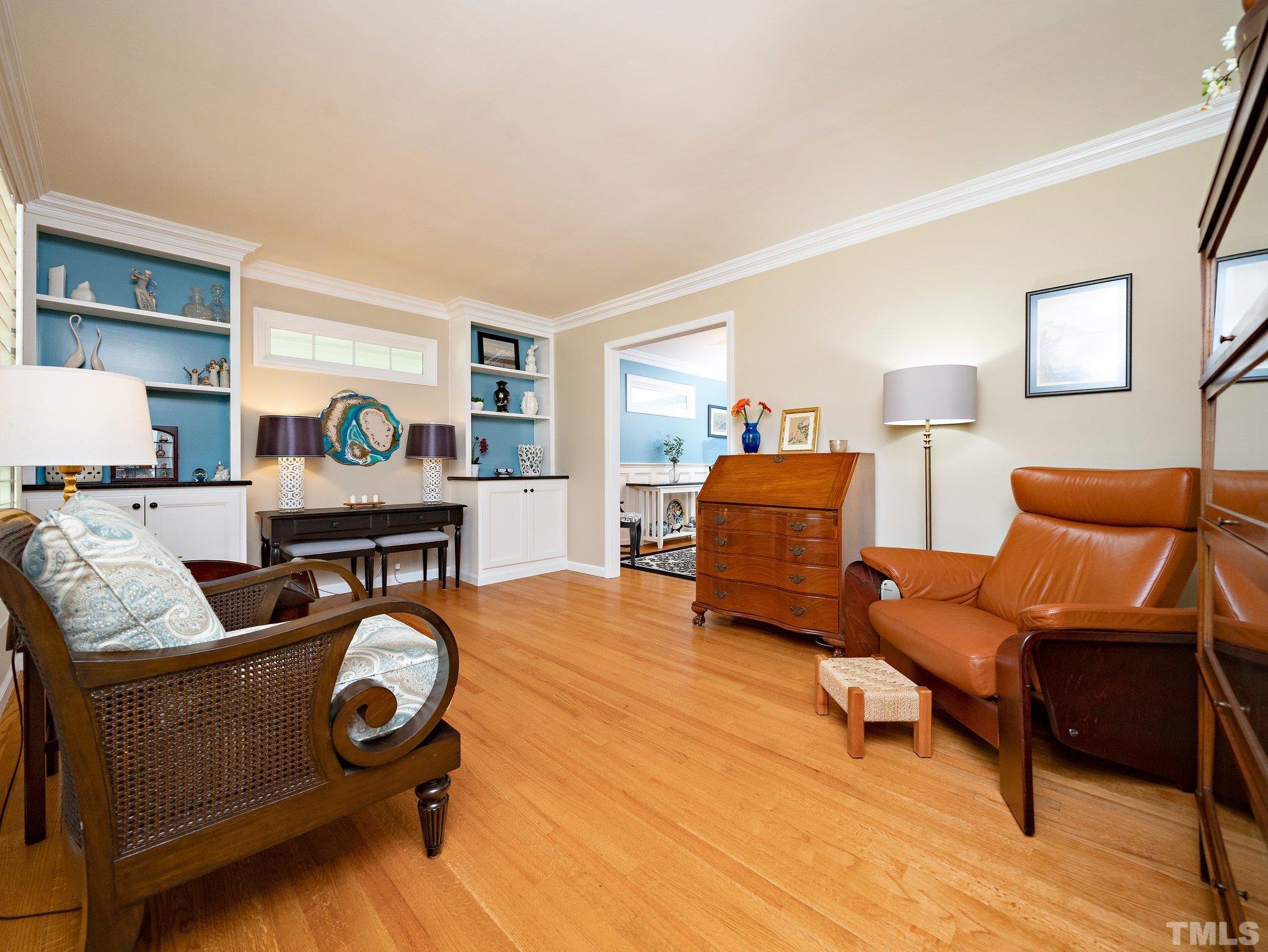 4508 Old Village Road Raleigh, NC 27612 - Photo 13 of 29 a living room with furniture and a wooden floor
