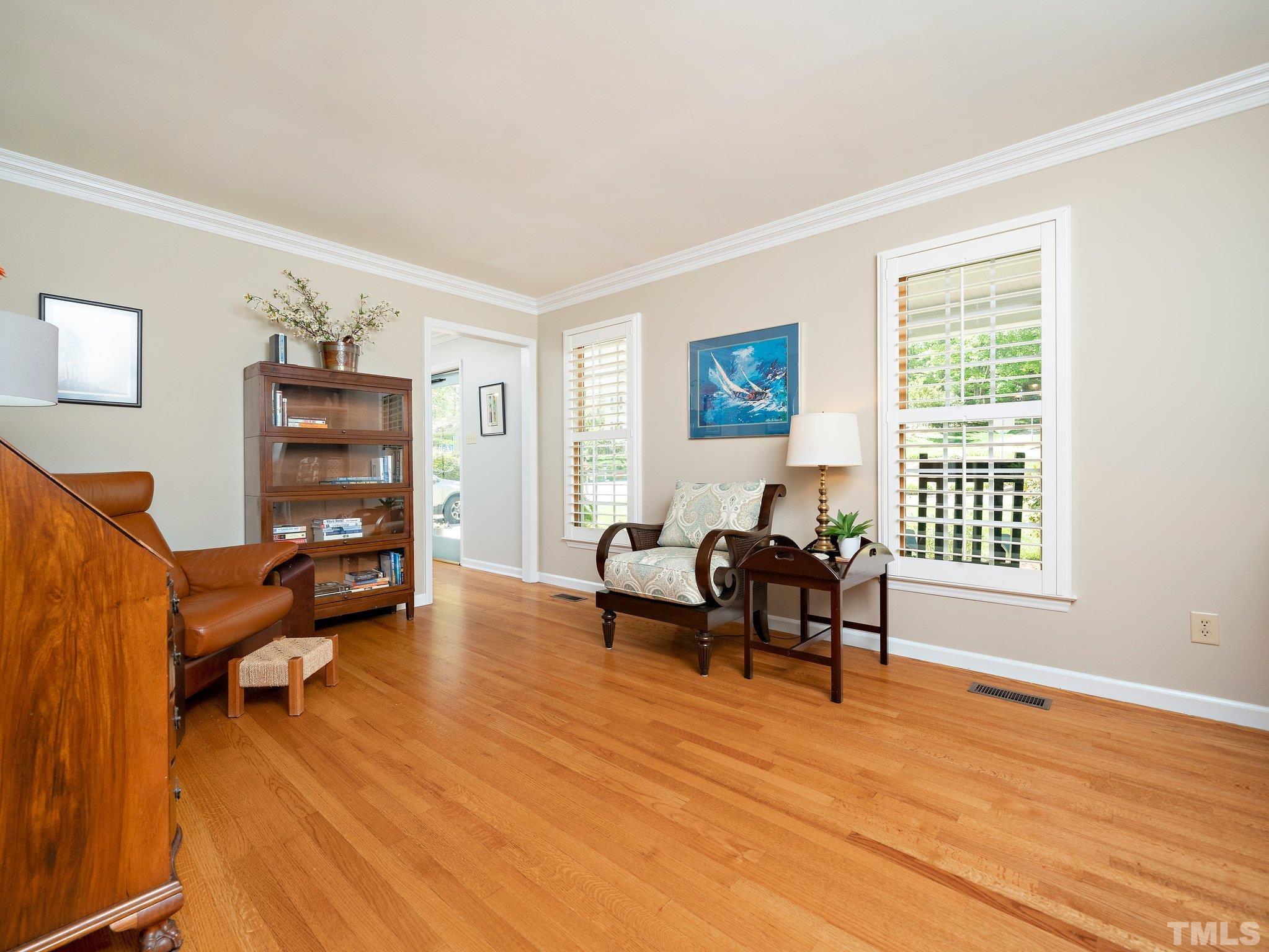 4508 Old Village Road Raleigh, NC 27612 - Photo 14 of 29 a living room with furniture and a wooden floor