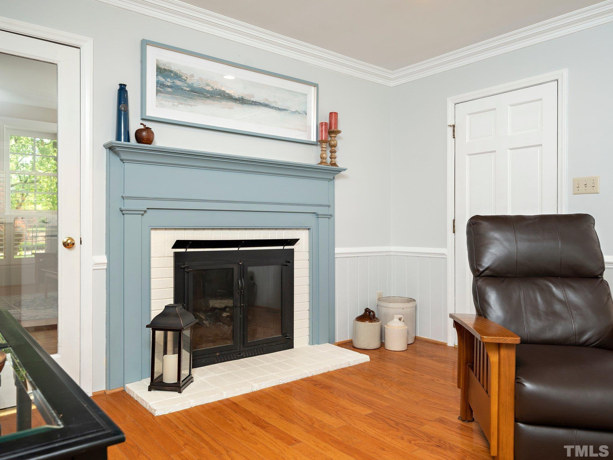 4508 Old Village Road Raleigh, NC 27612 - Photo 16 of 29 a bedroom with a bed and a fireplace