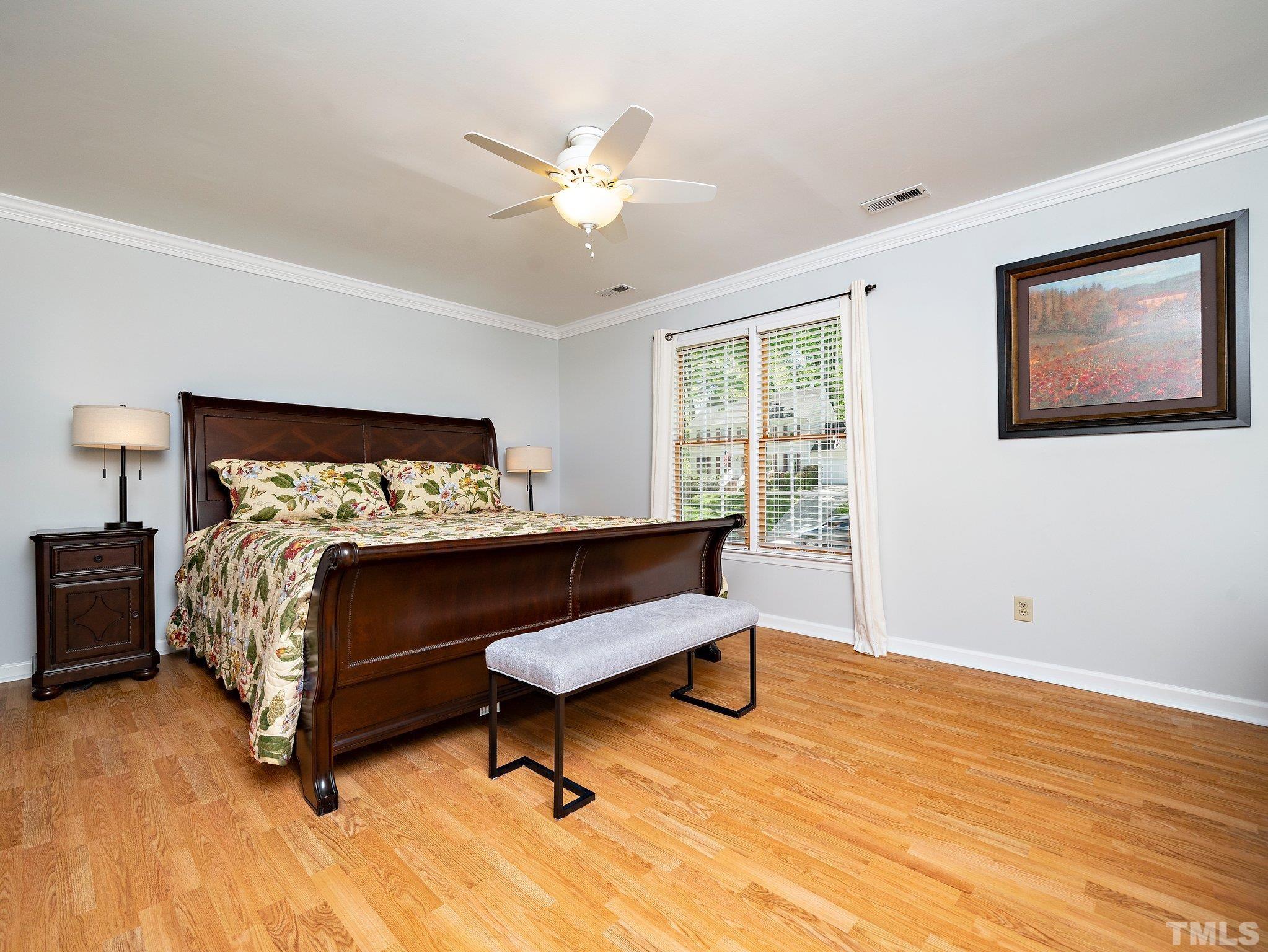 4508 Old Village Road Raleigh, NC 27612 - Photo 19 of 29 a bedroom with a bed and a window