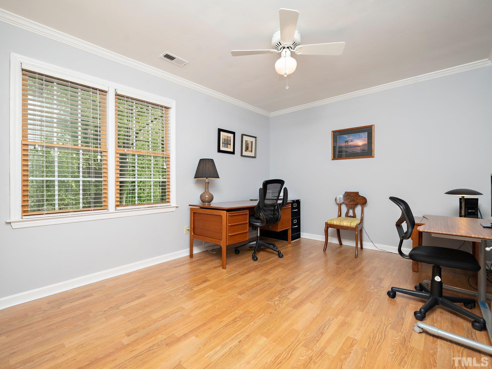 4508 Old Village Road Raleigh, NC 27612 - Photo 24 of 29 a view of a workspace with furniture and a window