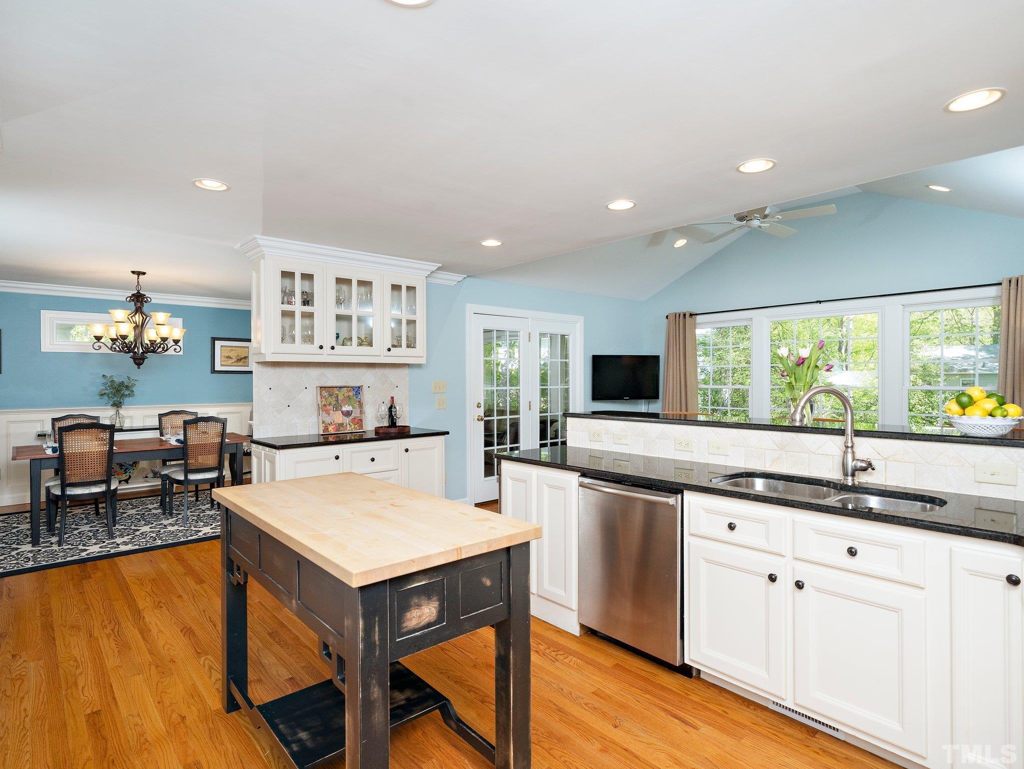4508 Old Village Road Raleigh, NC 27612 - Photo 3 of 29 a kitchen with stainless steel appliances granite countertop a sink and cabinets