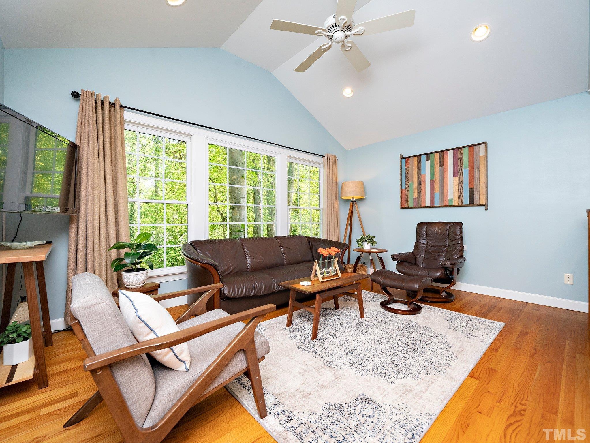 4508 Old Village Road Raleigh, NC 27612 - Photo 8 of 29 a living room with furniture and a flat screen tv