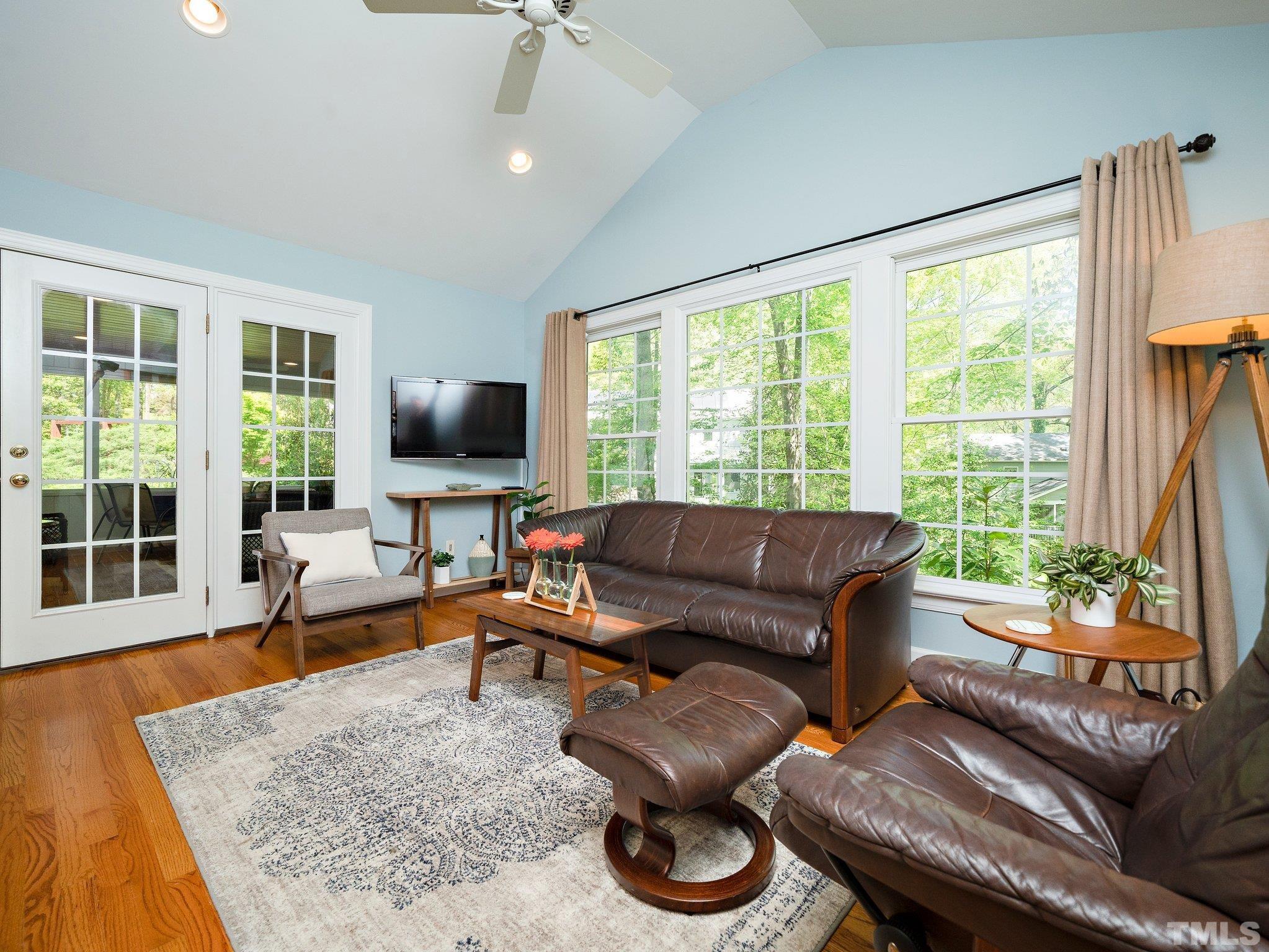 4508 Old Village Road Raleigh, NC 27612 - Photo 10 of 29 a living room with furniture and a flat screen tv
