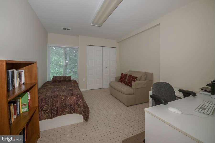 7906 Inverness Ridge Road Potomac, MD 20854 - Photo 22 of 30 a living room with furniture and a window