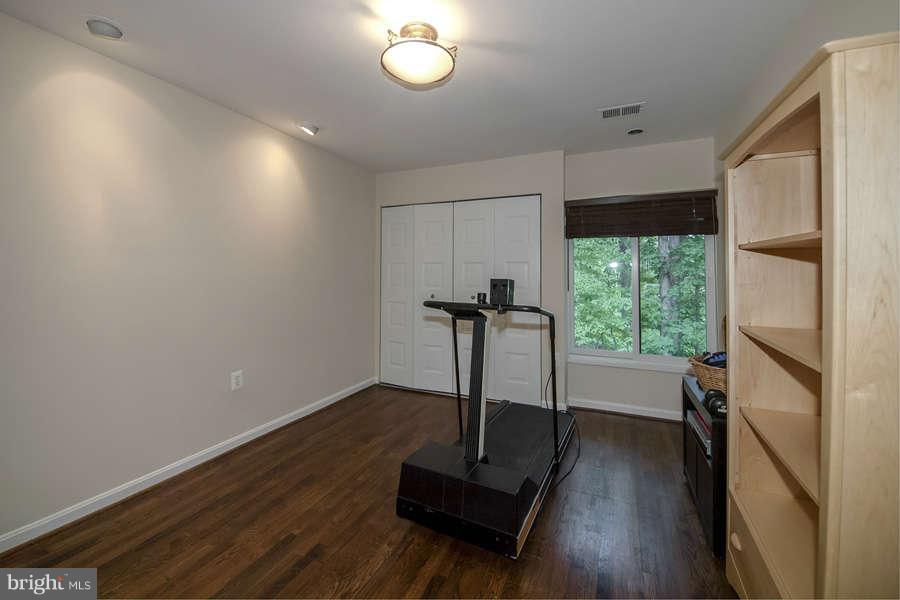 7906 Inverness Ridge Road Potomac, MD 20854 - Photo 23 of 30 a view of a room with wooden floor and a window