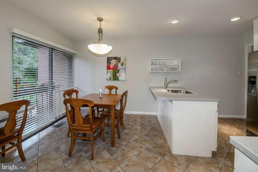 7906 Inverness Ridge Road Potomac, MD 20854 - Photo 7 of 30 a dining room with furniture and window