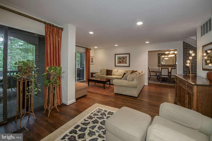 7906 Inverness Ridge Road Potomac, MD 20854 - Photo 8 of 30 a living room with furniture lamp and wooden floor