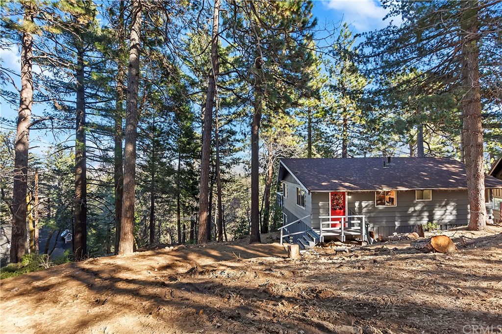 962 Coulter Pine Road Crestline, CA 92325 - Photo 1 of 25 a view of street with large trees