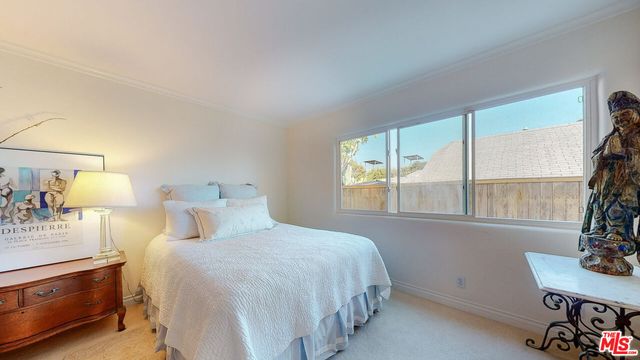 a bathroom with a bathtub sink vanity mirror and toilet