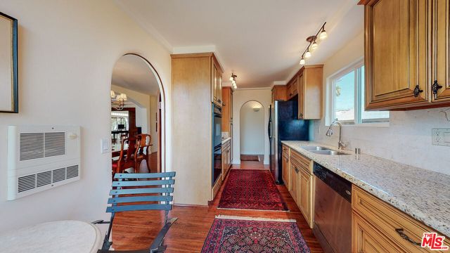 a living room with furniture dining table and wooden floor