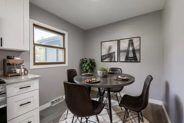 a dining room with furniture and window