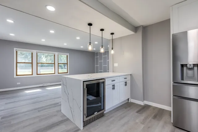 a kitchen with a stove and a refrigerator