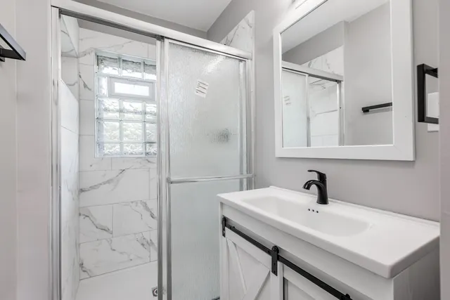 a bathroom with a sink and mirror