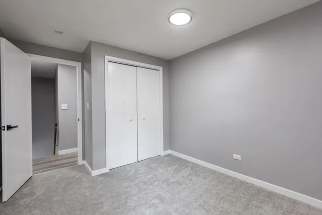an empty room with closet area