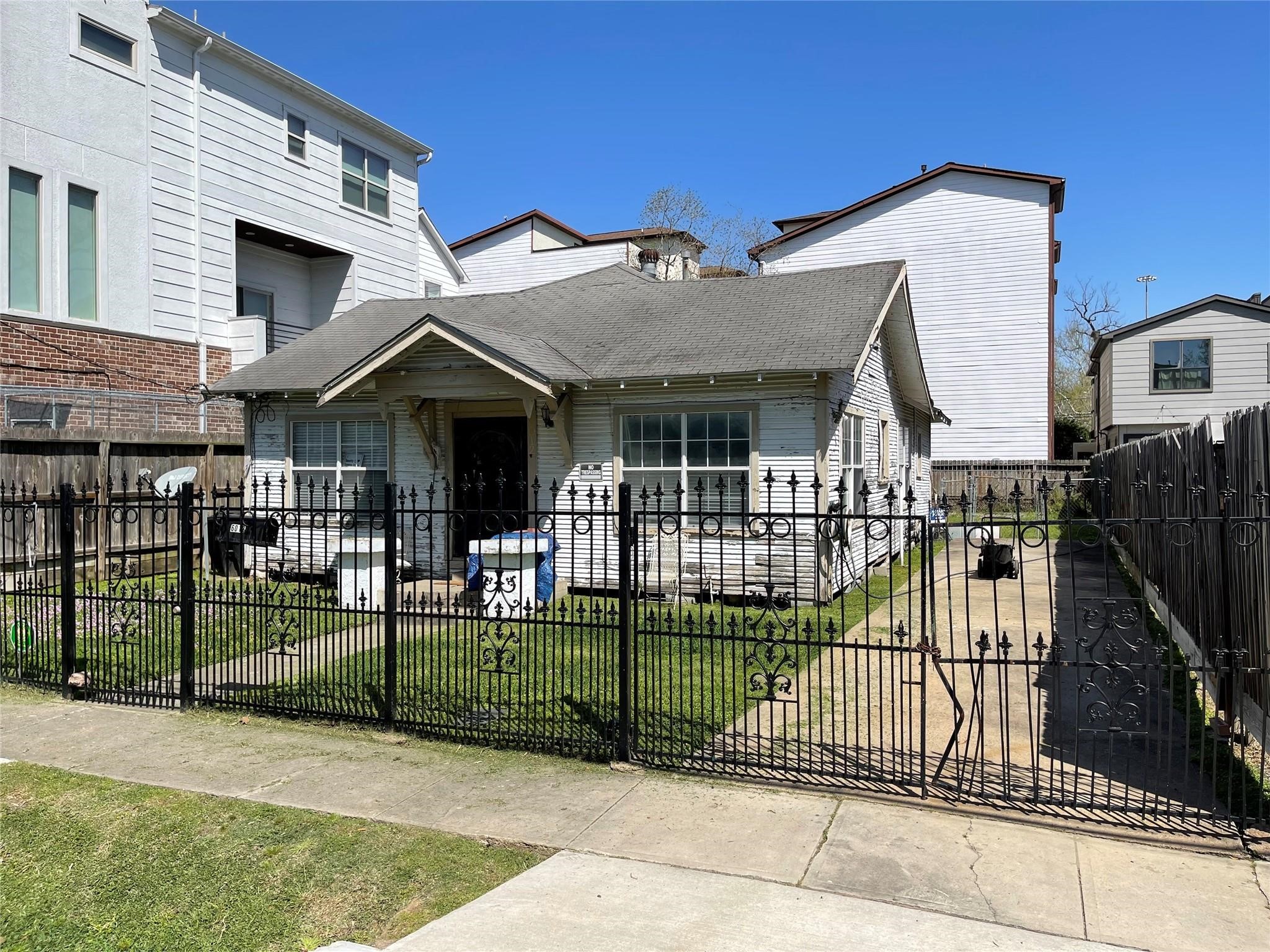 6012 Clyde Street Houston, TX 77007 - Photo 3 of 7 a view of a house with wooden fence