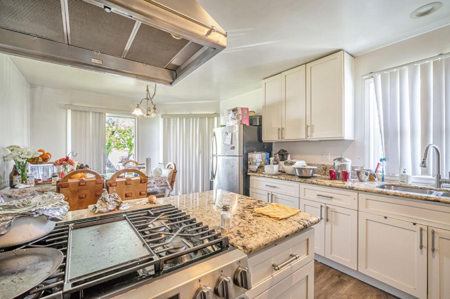 838 Wheeler Street Santa Rosa, CA 95404 - Photo 15 of 45 a kitchen with kitchen island granite countertop lots of counter top space and stainless steel appliances