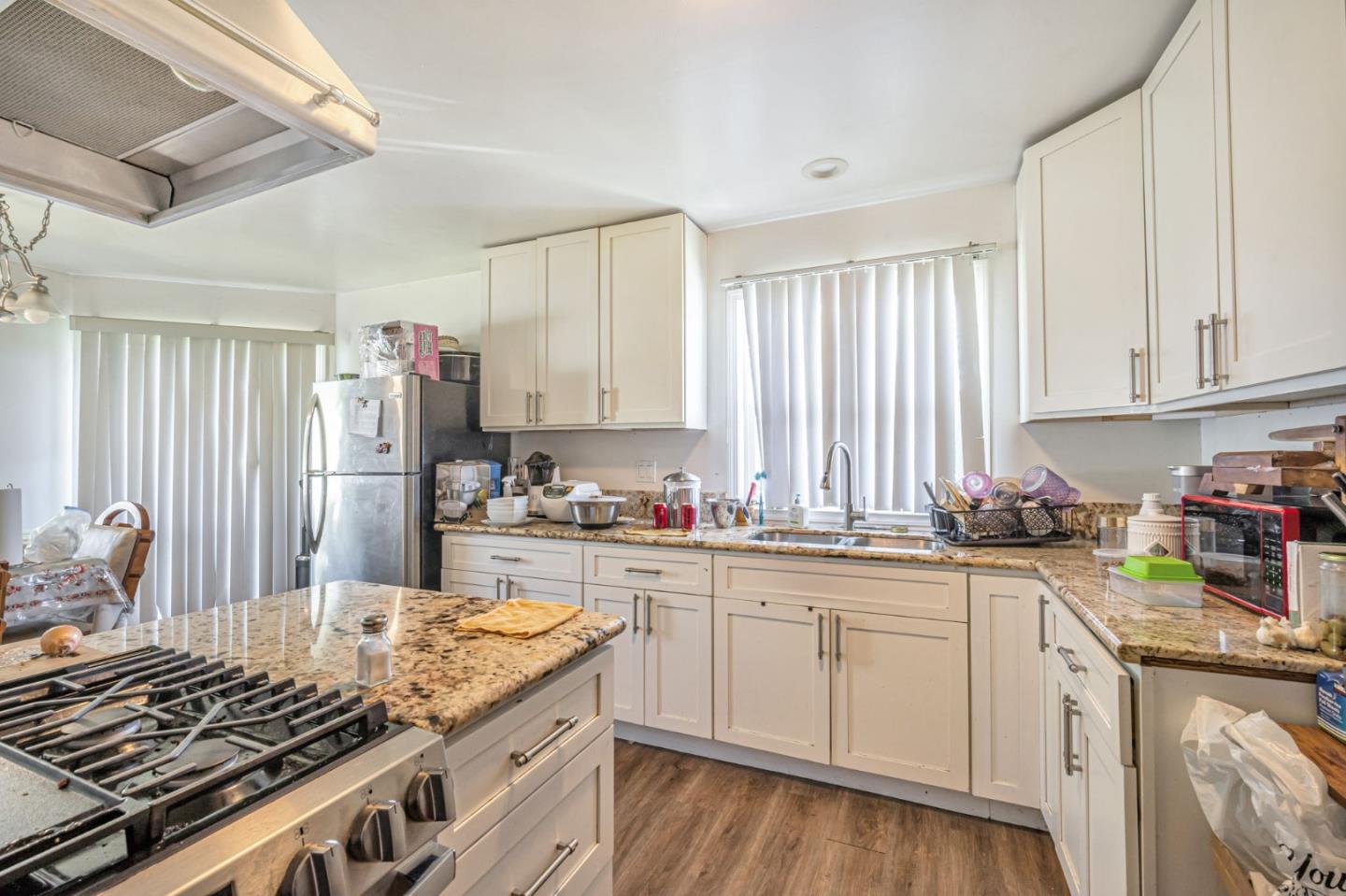 838 Wheeler Street Santa Rosa, CA 95404 - Photo 16 of 45 a kitchen with a sink stove and cabinets