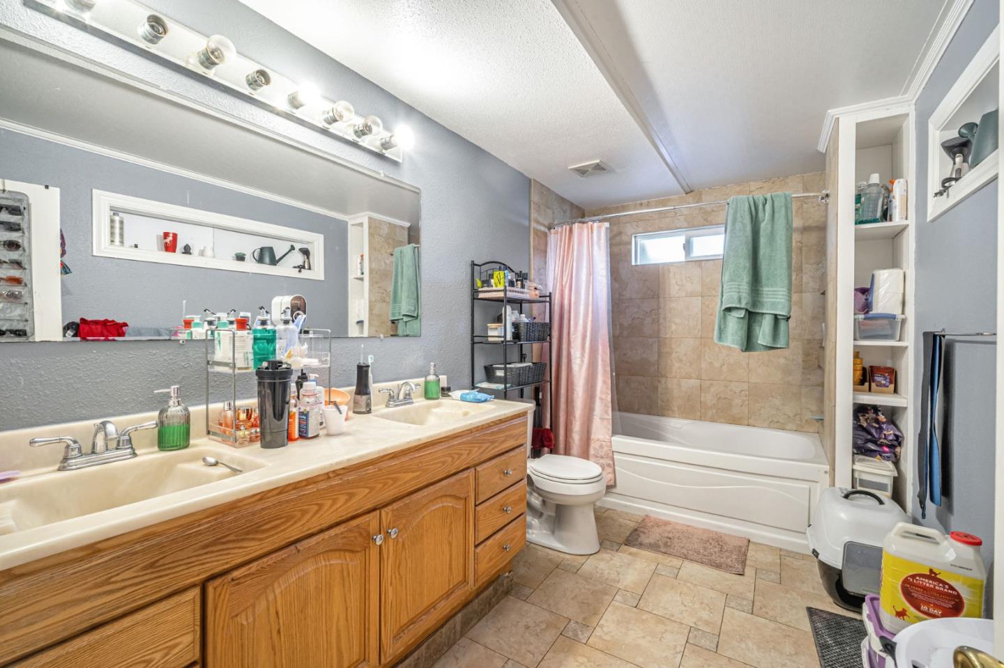 838 Wheeler Street Santa Rosa, CA 95404 - Photo 32 of 45 a bathroom with a double vanity sink toilet mirror and bathtub