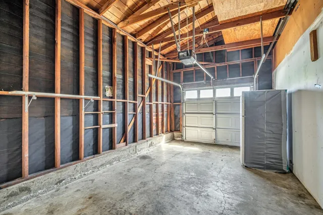 a view of backyard with small cabin