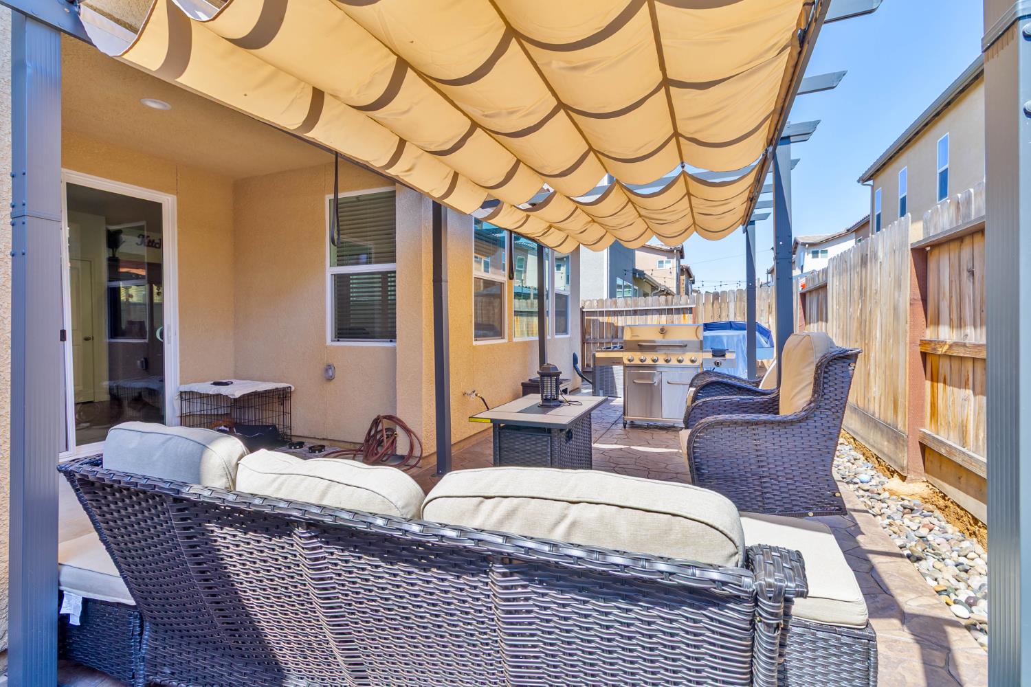 915 Winchell Way West Madera, CA 93636 - Photo 5 of 36 a living room with furniture a large window and a chandelier