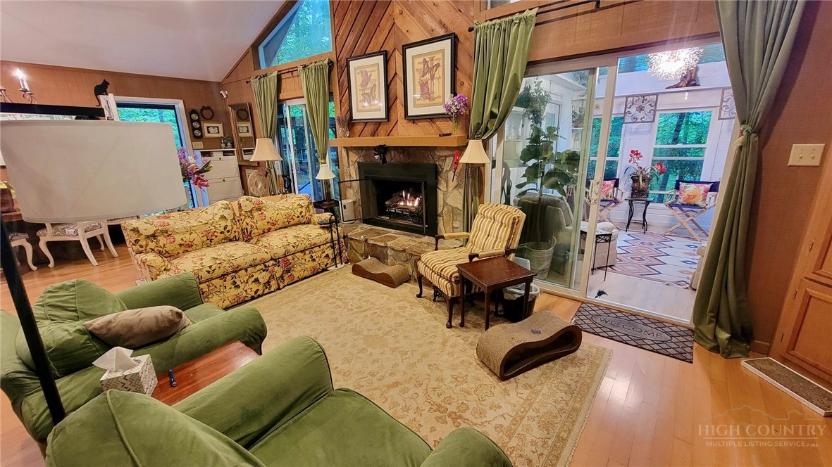 111 Locust Ridge Road Beech Mountain, NC 28604 - Photo 3 of 21 a living room with furniture and a fireplace