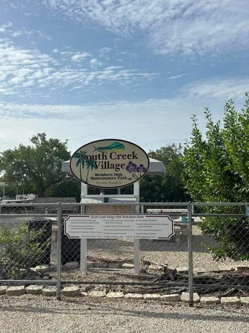 a view of a swimming pool with a yard