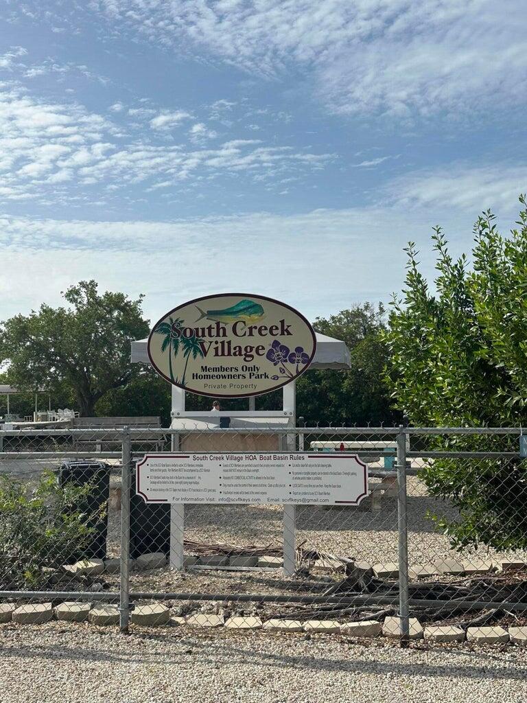 338 Sound Drive Key Largo, FL 33037 - Photo 4 of 6 a view of a swimming pool with a yard