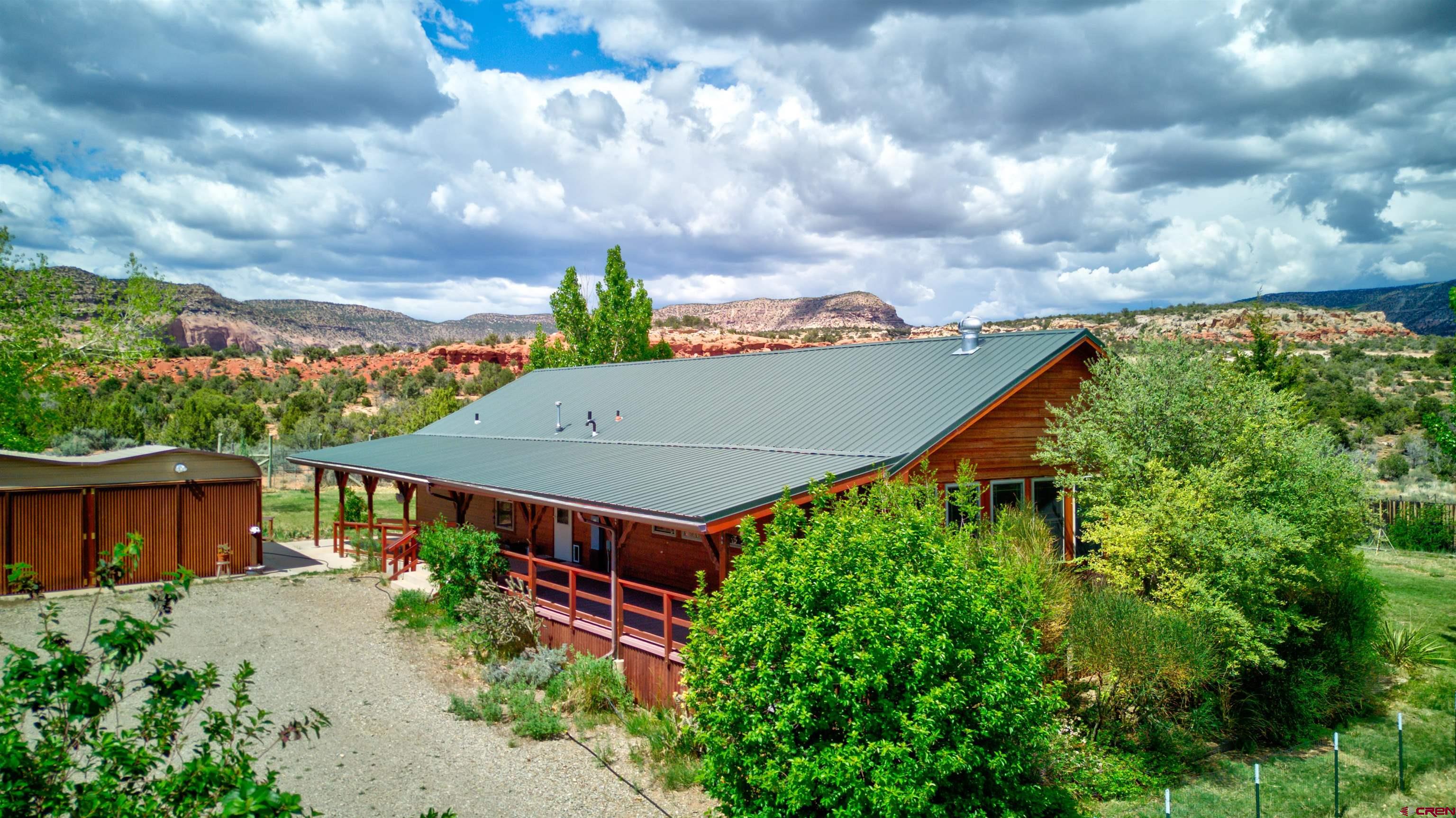 12299 Rd G Cortez, CO 81321 - Photo 1 of 44 a view of a garden with an outdoor seating