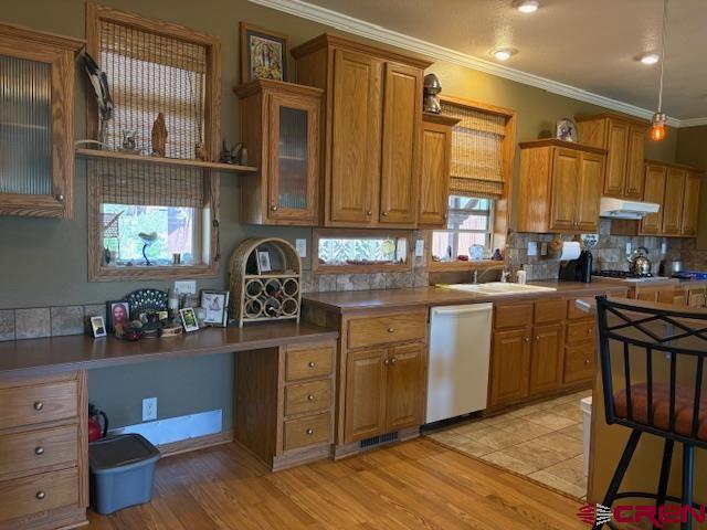 12299 Rd G Cortez, CO 81321 - Photo 11 of 44 a kitchen with a stove a sink and a refrigerator