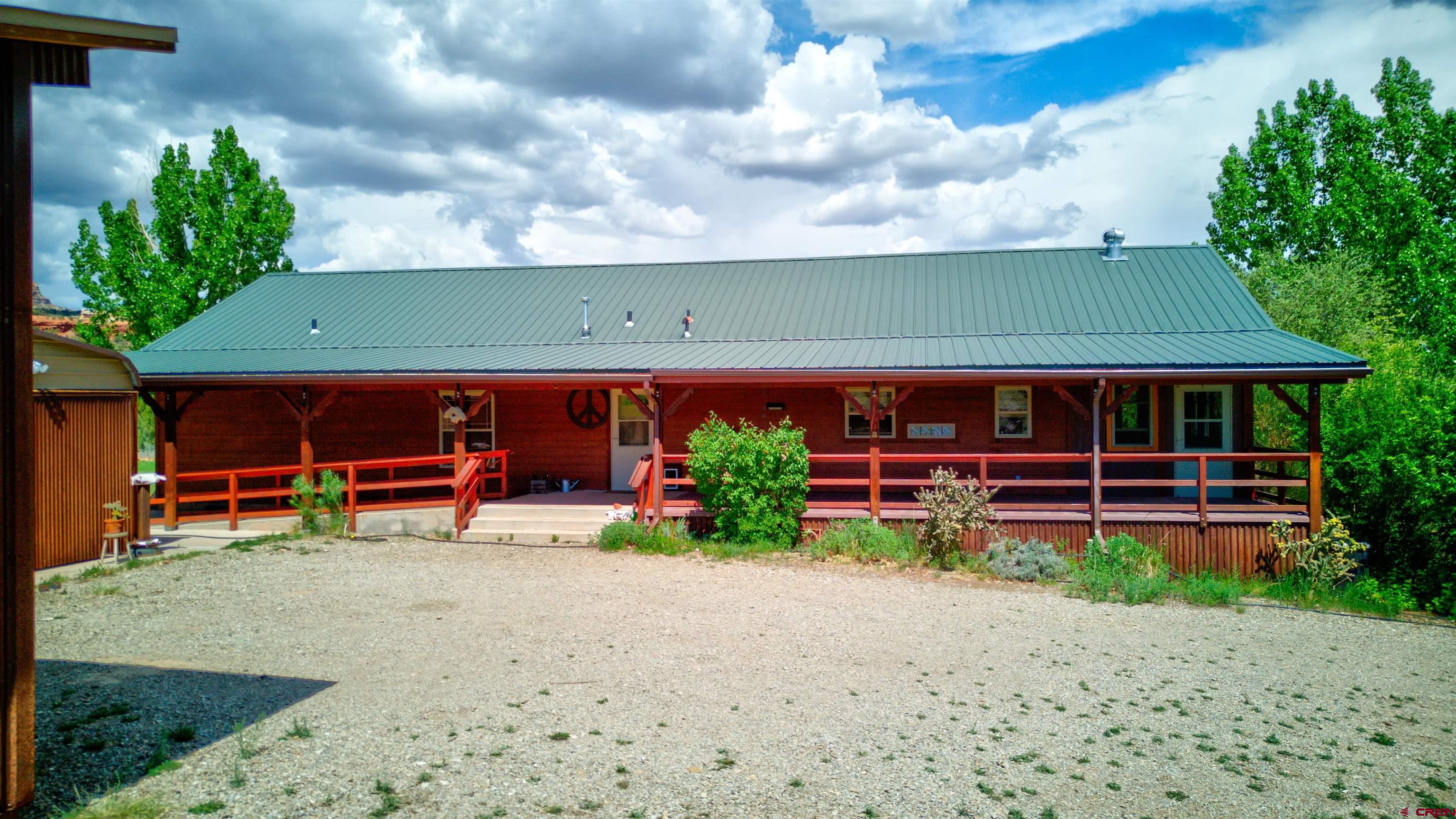 12299 Rd G Cortez, CO 81321 - Photo 2 of 44 a view of a house with wooden fence