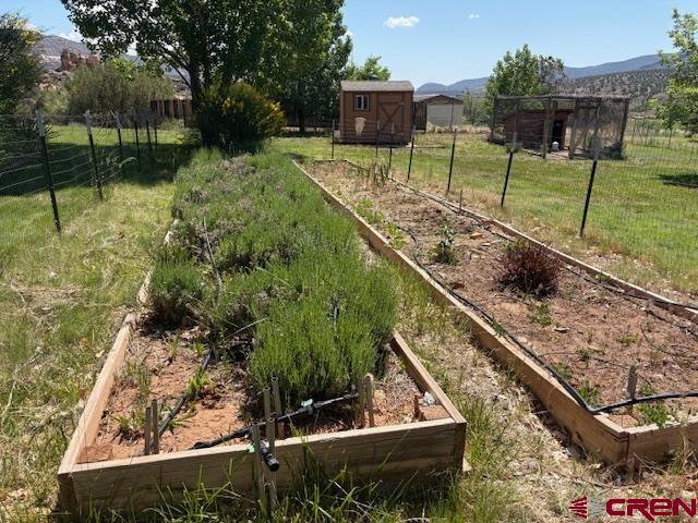 12299 Rd G Cortez, CO 81321 - Photo 31 of 44 a view of a wooden deck with a yard